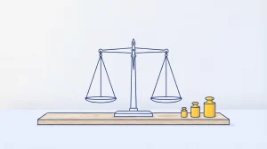 Metallwaage auf einem Tisch mit mehreren unterschiedlich großen Gewichten